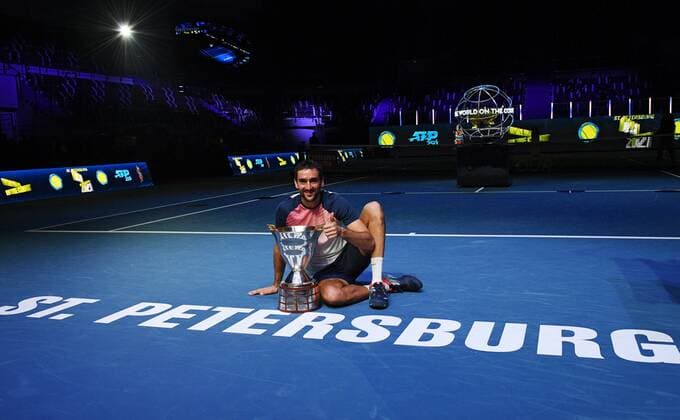 6686269 31.10.2021 Croatia s Marin ?ili?? poses with a trophy after winning the men s singles final match against Taylor Fritz, of the USA, at the St. Petersburg Open international tennis tournament in St. Petersburg, Russia. Alexander Galperin Sputnik Russia Tennis St Petersburg Open  e51163024d27b5e7