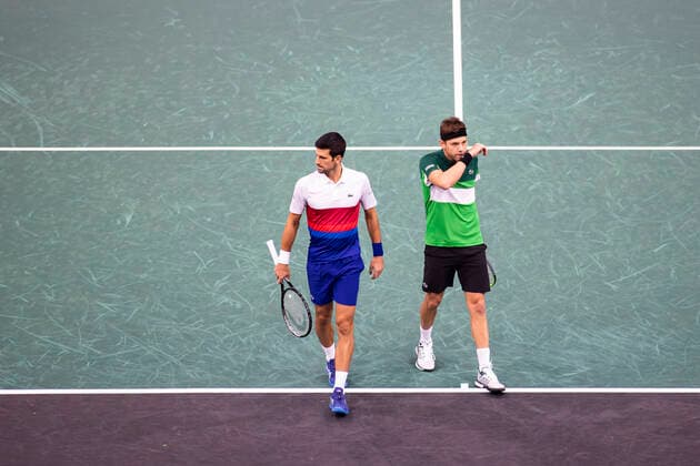 Paris, France, November 1st, 2021 - Novak Djokovic (L) and Filip Krajinovic (R), both of Serbia, react during their doubles second round match against Alex de Minaur and Luke Saville, both of Australia, at the Rolex Paris Masters tennis tournament.  Copyright: xAlexisxSciardx