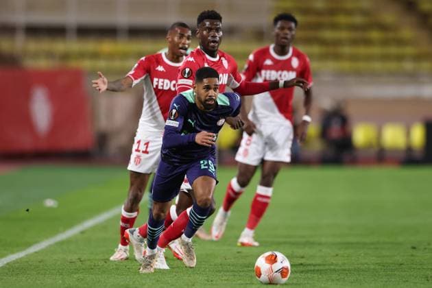 Monaco, Monaco, 4th November 2021. Phillipp Mwene of PSV Eindhoven breaks with the ball as Benoit Badiashile of AS Monaco looks on during the UEFA Europa League match at Stade Louis II, Monaco. Picture credit should read: Jonathan Moscrop Sportimage EDITORIAL USE ONLY. No use with unauthorised audio, video, data, fixture lists, club league logos or live services. Online in-match use limited to 120 images, no video emulation. No use in betting, games or single club league player publications. SPI-1284-0004