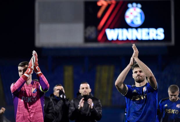 Dinamo Zagreb v Rapid Wien: Group H - UEFA Europa League Goalkeeper Dominik Livakovic of Dinamo Zagreb and Bruno Petkovic of Dinamo Zagreb celebrate after the UEFA Europa League group H match between Dinamo Zagreb and Rapid Wien at Maksimir Stadium on November 4, 2021 in Zagreb, Croatia. MarkoxLukunic PIXSELL