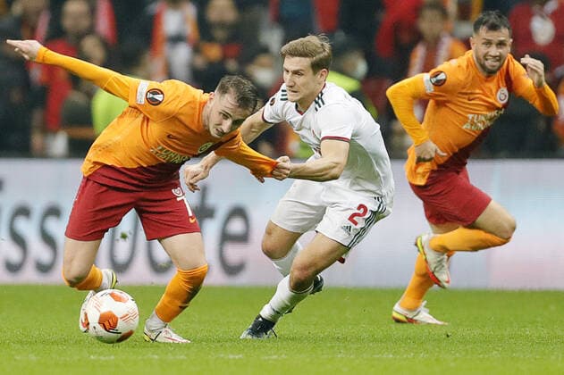 ISTANBUL, TURKEY - NOVEMBER 4, 2021: Galatasaray s Kerem Akturkoglu, Lokomotivâ€™s Dmitry Zhivoglyadov, and Galatasaray s Omer Bayram (L-R) in action in the 2021 22 UEFA Europa League Group E Round 4 match between Galatasaray Istanbul and Lokomotiv Moscow at the Ali Sami Yen Sports Complex. Mikhail Japaridze TASS  TS116D32