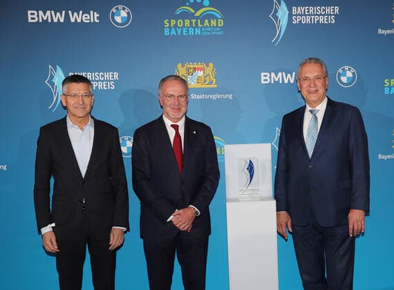 Bavarias Interior Minister Joachim Herrmann honors Karl Heinz Rummenigge with the Bavarian Sports Award 2021for his lifes work in sports Karl Heinz Rummenigge and Herbert Hainer together with Bavarian Interior Minister Joachim Herrmann Munich Bavaria Germany BMW Welt