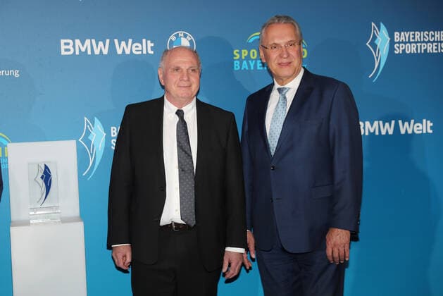 Bavarias Minister of the Interior Joachim Herrmann honours Karl Heinz Rummenigge with the Bavarian Sports Award 2021for his lifes work in sport Uli Hoeneß and Bavarian Minister of the Interior Joachim Herrmann Munich Bavaria Germany BMW World