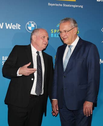 Bavarias Interior Minister Joachim Herrmann honors Karl Heinz Rummenigge with the Bavarian Sports Award 2021for his lifes work in sports Uli Hoeneß and Joachim Herrmann Munich Bavaria Germany BMW World