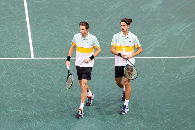 Paris, France, November 7, 2021 - French players Pierre Hugues Herbert (R) and Nicolas Mahut (L) in action during their doubles final match against Tim Puetz from Germany and Michael Venus from New Zealand, at the Rolex Paris Masters tennis tournament.  Copyright: xAlexisxSciardx