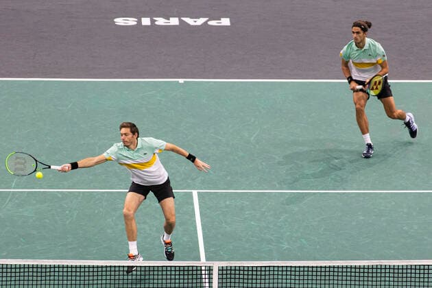 Paris, France, November 7, 2021 - French players Pierre Hugues Herbert (R) and Nicolas Mahut (L) in action during their doubles final match against Tim Puetz from Germany and Michael Venus from New Zealand, at the Rolex Paris Masters tennis tournament.  Copyright: xAlexisxSciardx