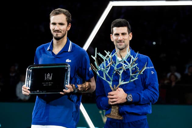 Paris, France, November 7, 2021 - After the men s single final tennis match of the Rolex Paris Masters tournament, Russia s Daniil Medvedev (L) and Serbia s Novak Djokovic (R) pose with their trophy.  Copyright: xAlexisxSciardx