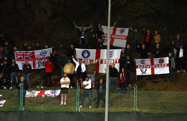 Mandatory Credit: Photo by Kieran McManus Shutterstock (12603417ac) England fans watch from a hill outside the stadium San Marino v England, FIFA World Cup, WM, Weltmeisterschaft, Fussball 2022 Qualifying, Group I, Football, San Marino Stadium, Serravalle, San Marino - 15 Nov 2021 EDITORIAL USE ONLY No use with unauthorised audio, video, data, fixture lists, club league logos or live services. Online in-match use limited to 120 images, no video emulation. No use in betting, games or single club league player publications. San Marino v England, FIFA World Cup 2022 Qualifying, Group I, Football, San Marino Stadium, Serravalle, San Marino - 15 Nov 2021 EDITORIAL USE ONLY No use with unauthorised audio, video, data, fixture lists, club league logos or live services. Online in-match use limited to 120 images, no video emulation. No use in betting, games or single club league player publications. Copyright: xKieranxMcManus Shutterstockx 12603417ac