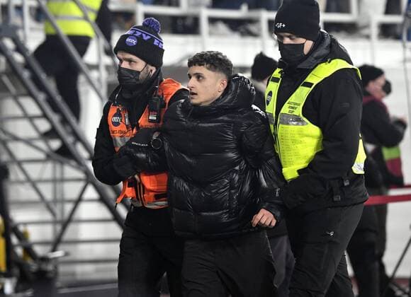 Pitch invader is taken into custody after the FIFA World Cup, WM, Weltmeisterschaft, Fussball Qatar 2022 Group D qualification match Finland vs France at the Helsinki Olympic Stadium in Helsinki, Finland on Tuesday, 16th Nov., 2021. Helsinki Finland LKFTJ20211116234027CHPC  Copyright: xJussixNukarix