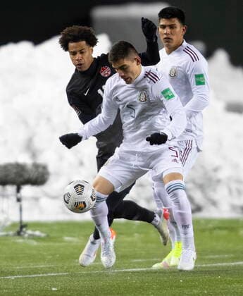 November 16, 2021, EDMONTON, ab, Canada: Canada s Tajon Buchannan (11) and Mexico s Johan Felipe Vasquez Ibarra (5) via for the ball during World Cup Qualifiers in Edmonton, Tuesday, Nov. 16, 2021. Tajon Buchannan Johan Felipe Vasquez Ibarra  - ZUMAc35_ 20211116_zaf_c35_155 Copyright: xJasonxFransonx