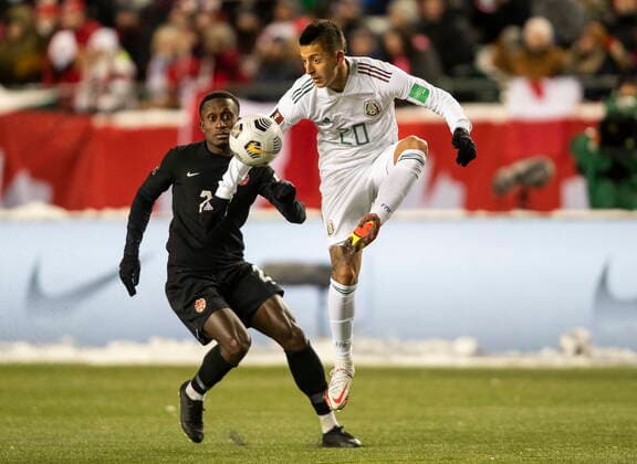 November 16, 2021, EDMONTON, ab, Canada: Canada s Jonathan David (20) and Mexico s Roberto Carlos Alvarado Hernandez (20) vie for the ball during second half World Cup Qualifiers in Edmonton, Tuesday, Nov. 16, 2021. Jonathan David Roberto Carlos Alvarado Criate  - ZUMAc35_ 20211116_zaf_c35_203 Copyright: xJasonxFransonx