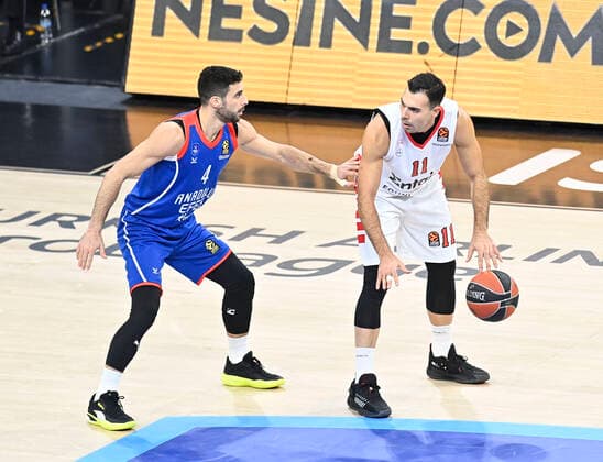Basketball, Euroleague, Anadolu Efes Istanbul - Olympiacos Piräus Dogus Balbay (4) of Anadolu Efes Istanbul and Kostas Sloukas (R) of Olympiacos during the Turkish Airlines Euroleague match between Anadolu Efes Istanbul and Olympiacos at Sinan Erdem Arena in Istanbul , Turkey on November 17 , 2021. 