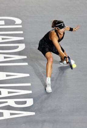 (211118) -- GUADALAJARA, Nov. 18, 2021 -- Spain s Garbine Muguruza hits a return during the women s singles final between Spain s Garbine Muguruza and Estonia s Anett Kontaveit at the AKRON WTA, Tennis Damen Finals in Guadalajara, Mexico, on Nov. 17, 2021. (Photo by Jorge Reyes Xinhua) (SP)MEXICO-GUADALAJARA-TENNIS-WTA FINALS-SINGLES XinxYuewei 