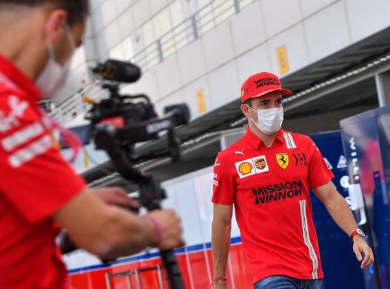 (211119) -- DOHA, Nov. 19, 2021 -- Scuderia Ferrari Mission Winnow driver Charles Leclerc of Monaco walks through paddock at the Losail International Circuit ahead of the Qatar Formula One Grand Prix in Doha, Qatar, Nov. 18, 2021. (Photo by Nikku Xinhua) (SP)QATAR-DOHA-F1-LOSAIL INTERNATIONAL CIRCUIT yangyuanyong 