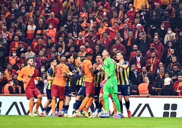 Goalkeeper Fernando Muslera , Marcao of Galatasaray and Mesut Ozil , Jose Sosa , Ferdi Kadioglu of Fenerbahce during the Turkish super league big derby match between Galatasaray and Fenerbahce at NEF stadium in Istanbul , Turkey on November 21, 2021. 