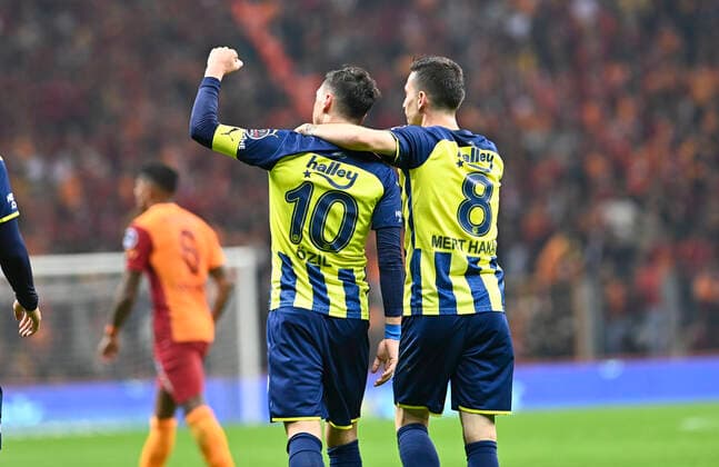 Mesut Ozil and Irfan Can Kahveci of Fenerbahce during the Turkish super league big derby match between Galatasaray and Fenerbahce at NEF stadium in Istanbul , Turkey on November 21, 2021. 