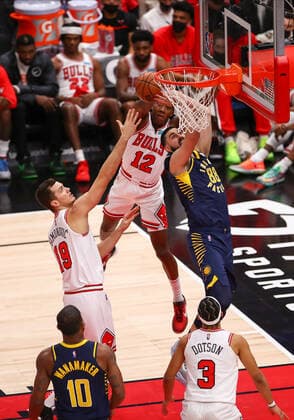 CHICAGO, IL - NOVEMBER 22: Chicago Bulls Guard Ayo Dosunmu (12) blocks Indiana Pacers Center Goga Bitadze (88) layup during a NBA, Basketball Herren, USA game between the Indiana Pacers and the Chicago Bulls on November 22, 2021 at the United Center in Chicago, IL. (Photo by Melissa Tamez Icon Sportswire) NBA: NOV 22 Pacers at Bulls Icon211122035