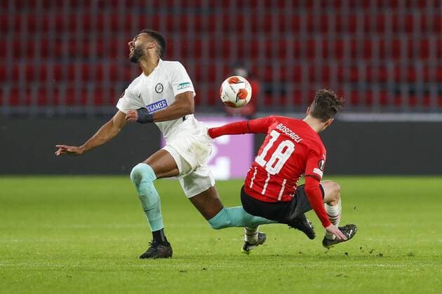EINDHOVEN - 25-11-2021, Philips stadion. Europa League, season 2021-2022. during the match PSV - Sturm Graz. Sturm Graz player Gregory Wuthrich and PSV player Olivier Boscagli PSV - Sturm Graz  x14465527x Copyright: