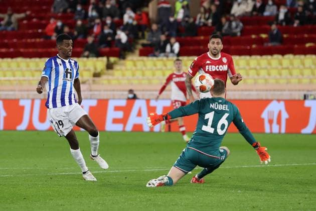 Monaco, Monaco, 25th November 2021. Alexander Isak of Real Sociedad scores past Alexander Nubel of AS Monaco to level the game at 1-1 during the UEFA Europa League match at Stade Louis II, Monaco. Picture credit should read: Jonathan Moscrop Sportimage EDITORIAL USE ONLY. No use with unauthorised audio, video, data, fixture lists, club league logos or live services. Online in-match use limited to 120 images, no video emulation. No use in betting, games or single club league player publications. SPI-1343-0007
