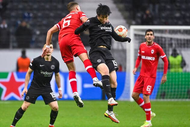 Antwerp s Birger Verstraete and Eintracht s Daichi Kamada fight for the ball during a soccer game between German Eintracht Frankfurt and Belgian Royal Antwerp FC, Thursday 25 November 2021 in Frankfurt, Germany, game five (out of six) in Group D of the UEFA Europa League group stage. LAURIExDIEFFEMBACQ  x3143542x