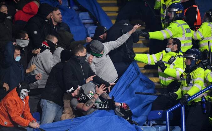 Mandatory Credit: Photo by Anna Gowthorpe Shutterstock (12617592ag) Legia Warsaw fans fight police officers Leicester City v Legia Warsaw, UEFA Europa League, Group C, Football, The King Power Stadium, Leicester, UK - 25 Nov 2021 EDITORIAL USE ONLY No use with unauthorised audio, video, data, fixture lists, club league logos or live services. Online in-match use limited to 120 images, no video emulation. No use in betting, games or single club league player publications. Leicester City v Legia Warsaw, UEFA Europa League, Group C, Football, The King Power Stadium, Leicester, UK - 25 Nov 2021 EDITORIAL USE ONLY No use with unauthorised audio, video, data, fixture lists, club league logos or live services. Online in-match use limited to 120 images, no video emulation. No use in betting, games or single club league player publications. Copyright: xAnnaxGowthorpe Shutterstockx 12617592ag