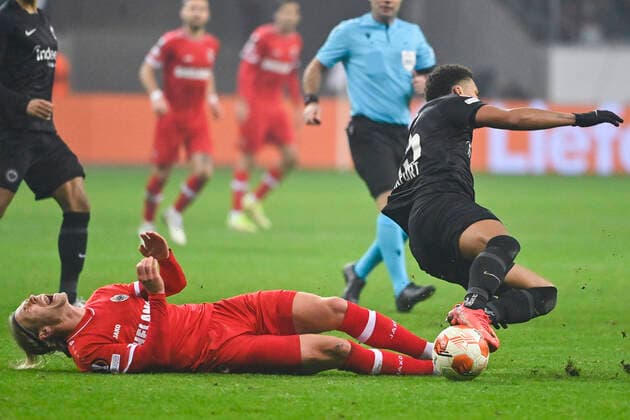 Antwerp s Viktor Fischer and Eintracht s Tuta fight for the ball during a soccer game between German Eintracht Frankfurt and Belgian Royal Antwerp FC, Thursday 25 November 2021 in Frankfurt, Germany, game five (out of six) in Group D of the UEFA Europa League group stage. LAURIExDIEFFEMBACQ  x3143608x