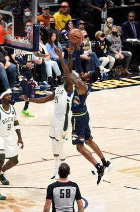Denver Nuggets forward Will Barton 5, (R), goes up for a basket against Milwaukee Bucks guard Jrue Holiday 21, (C), as Milwaukee Bucks center Bobby Portis 9,(L), looks on during the first quarter at the Ball Arena in Denver, CO, USA, 26 November 2021. Denver Nuggets vs. Milwaukee Bucks !ACHTUNG: NUR REDAKTIONELLE NUTZUNG!  Copyright: xToddxPiersonx AME937 20211127-3d610652150e8a5a123351ee988946b0c1fcd87e