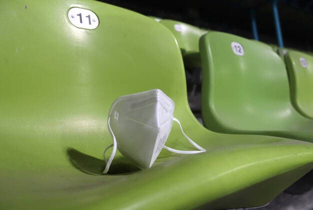 Munich, Germany 29 November 2021 Football, Men, 3 Liga, Season 2021 2022, Türkgücü Munich FSV Zwickau, Olympiastadion Munich An FFP2 mask on an empty seating bowl, symbolic image ,Corona, Geisterspiele DFB regulations prohibit any use of photographs as image sequences and or quasi video
