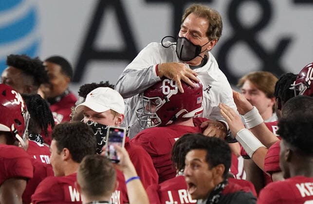 Alabama Crimson Tide head coach Nick Saban is carried off the field after defeating Ohio State 52-24 in the 2021 NCAA, College League, USA National Championship football game at Hard Rock Stadium in Miami on Monday, January 11, 2021.  POY2021S036 HANSxDERYK