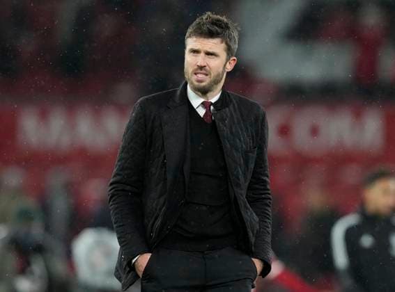 Manchester, England, 2nd December 2021. Stand in manager Michael Carrick leave the pitch at the final whistle during the Premier League match at Old Trafford, Manchester. Picture credit should read: Andrew Yates Sportimage EDITORIAL USE ONLY. No use with unauthorised audio, video, data, fixture lists, club league logos or live services. Online in-match use limited to 120 images, no video emulation. No use in betting, games or single club league player publications. SPI-1374-0175