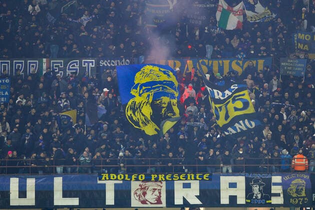 FC Inter vs Spezia Serie A 2021-2022 day 15 at San Siro stadium Italy, Milan, dec 1 2021: fc Inter supporters wave the flags and light smoke bombs in the stands during football match FC INTER vs SPEZIA, Serie A 2021-2022 day15 at San Siro stadium Milan Italy Copyright: FabrizioxAndreaxBertani