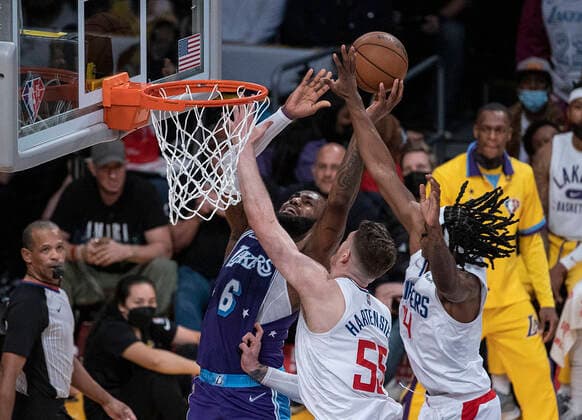 December 3, 2021, Los Angeles, California, USA: Isaiah Hartenstein 55 and Terance Mann 14 of the Los Angeles Clippers defend against LeBron James 6 of the Los Angeles Lakers as he goes for a shot during their regular season NBA, Basketball Herren, USA game on Friday December 3, 2021 at the Staples Center in Los Angeles, California. Lakers lose to Clippers, 115-119. PI Los Angeles USA - ZUMAp124 20211203_zaa_p124_032 Copyright: xJAVIERxROJASx