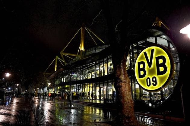 Football 1 Bundesliga, Matchday 14, Borussia Dortmund FC Bayern Munich on 04 12 2021 at Signal Iduna Park in Dortmund North Rhine Westphalia View of the BVB fanshop and behind it the Westfalenstadion The logo of Borussia Dortmund shines brightly in the darkness DFL REGULATIONS PROHIBIT ANY USE OF PHOTOGRAPHS AS IMAGE SEQUENCES AND OR QUASI VIDEO Copyright: xChristopherxNeundorfx