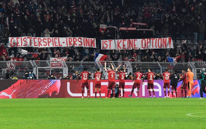 Football, Bundesliga, Germany, men, season 2021 2022, 14 matchday, Signal Iduna Park Dortmund Bor Dortmund, BVB yellow FC Bayern Munich, FCB red 2 3 Bayern players celebrate with their fans and a banner against ghost games DFB DFL REGULATES PROHIBIT ANY USE OF PHOTOGRAPHS AS IMAGE SEQUENCES AND OR QUASI VIDEO