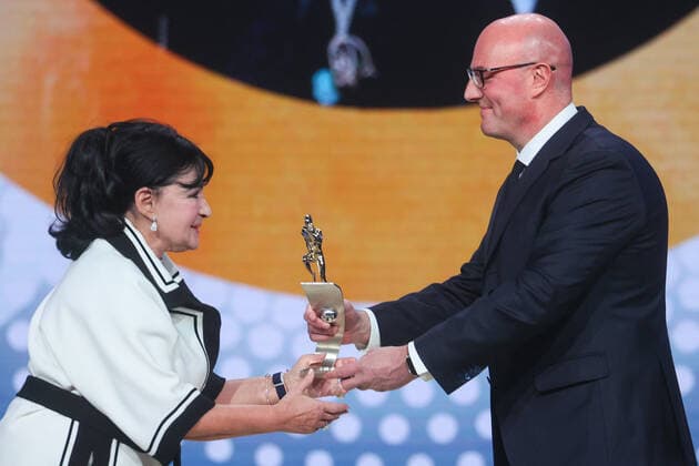 MOSCOW, RUSSIA - DECEMBER 8, 2021: Irina Viner-Usmanova (L), the head coach of the Russsian national Rhythmic gymnastics, Rhythmische Sportgymnastik, RSG national team, Nationalteam accepts her 2021 Russian National Sports Award from Russia s Deputy Prime Minister Dmitry Chernyshenko during a ceremony at Irina Viner-Usmanova Gymnastics Palace. Established in 2010 and coming with a million-rouble prize, the award is given to athletes, coaches, journalists and regional government officials who contributed to the promotion of Russian sports. Gavriil Grigorov TASS  0144159738st