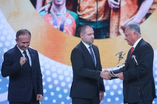 MOSCOW, RUSSIA - DECEMBER 8, 2021: Kemerovo Region Minister Sergei Myaus and Deputy Governor Sergei Alekseyev (L-R) accept the 2021 Russian National Sports Award for Best Region from Alexei Kulakovsky, Deputy Head of the Russian Presidential Directorate for Supporting State Council Activities, during a ceremony at Irina Viner-Usmanova Gymnastics Palace. Established in 2010 and coming with a million-rouble prize, the award is given to athletes, coaches, journalists and regional government officials who contributed to the promotion of Russian sports. Gavriil Grigorov TASS  0144161229st