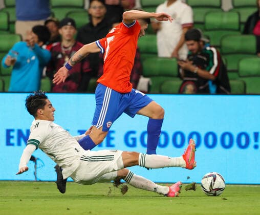 December 8, 2021: Mexico midfielder ERICK GERMAIN AGUIERRE TAFOLLA (14) makes a sliding tackle on Chile midfielder VICTOR MENDEZ (15) during an International Friendly, Länderspiel, Nationalmannschaft soccer match between Mexico and Chile on December 8, 2021 in Austin, Texas. - ZUMAc201 20211208_zap_c201_019 Copyright: xScottxColemanx