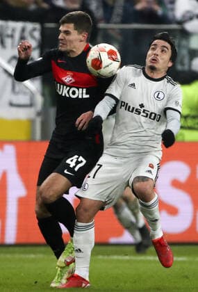 WARSAW, POLAND - DECEMBER 9, 2021: Spartak s Roman Zobnin (L) and Legia s Josue in action in the 2021 22 UEFA Europa League Group C Round 6 match between Spartak Moscow and Legia Warsaw at the Marshall Jozef Pilsudski s Municipal Stadium of Legia Warsaw. Alexander Demianchuk TASS  TS11B4B3