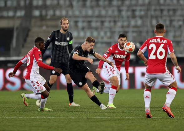 SOCCER - UEFA EL, Sturm vs Monaco GRAZ,AUSTRIA,09.DEC.21 - SOCCER - UEFA Europa League, group stage, SK Sturm Graz vs AS Monaco. Image shows Eliot Matazo (Monaco), Alexander Prass (Sturm), Kevin Volland and Ruben Aguilar (Monaco).  GEPAxpictures xMJxPaul