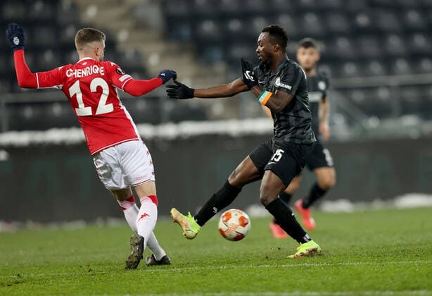 SOCCER - UEFA EL, Sturm vs Monaco GRAZ,AUSTRIA,09.DEC.21 - SOCCER - UEFA Europa League, group stage, SK Sturm Graz vs AS Monaco. Image shows Caio Henrique (Monaco) and Dogbole Franck Anderson Niangbo (Sturm).  GEPAxpictures xMJxPaul