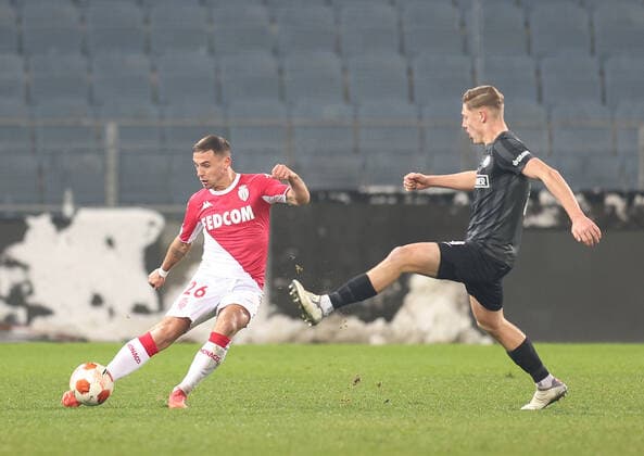 SOCCER - UEFA EL, Sturm vs Monaco GRAZ,AUSTRIA,09.DEC.21 - SOCCER - UEFA Europa League, group stage, SK Sturm Graz vs AS Monaco. Image shows Ruben Aguilar (Monaco) and Alexander Prass (Sturm) .  GEPAxpictures xChrisxBauer