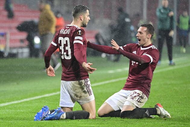 David Hancko of Sparta, left, celebrates with teammate Lukas Haraslin after scoring his side s first goal during the UEFA Europa League group A soccer match Sparta Praha vs Brondby Copenhagen in Prague, Czech Republic, December 9, 2021. (CTKxPhoto RomanxVondrous) CTKPhotoP2021120909112 