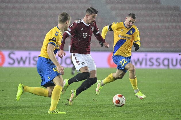 Adam Hlozek of Sparta, center, competes for the ball with Sigurd Rosted, left, and Josip Radosevic of Brondby during the UEFA Europa League group A soccer match Sparta Praha vs Brondby Copenhagen in Prague, Czech Republic, December 9, 2021. (CTKxPhoto RomanxVondrous) CTKPhotoP2021120908787 