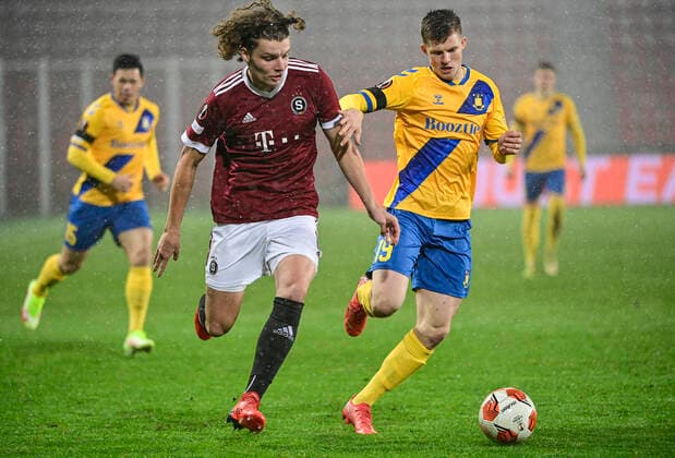 Filip Soucek of Sparta, left, and Morten Frendrup of Brondby challenge for the ball during the UEFA Europa League group A soccer match Sparta Praha vs Brondby Copenhagen in Prague, Czech Republic, December 9, 2021. (CTKxPhoto RomanxVondrous) CTKPhotoP2021120909346 