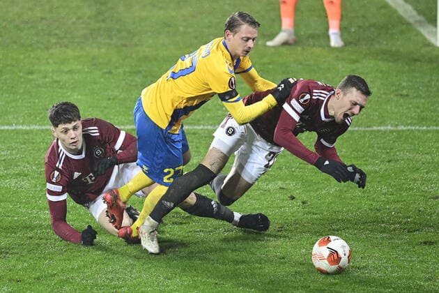 (L-R) Ladislav Krejci of Sparta, Simon Hedlund of Brondby and Lukas Haraslin of Sparta in action during the UEFA Europa League group A soccer match Sparta Praha vs Brondby Copenhagen in Prague, Czech Republic, December 9, 2021. (CTKxPhoto RomanxVondrous) CTKPhotoP2021120909485 
