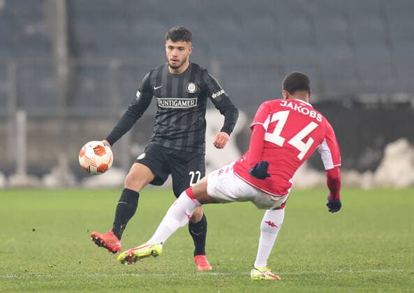SOCCER - UEFA EL, Sturm vs Monaco GRAZ,AUSTRIA,09.DEC.21 - SOCCER - UEFA Europa League, group stage, SK Sturm Graz vs AS Monaco. Image shows Jusuf Gazibegovic (Sturm) and Ismail Jakobs (Monaco) .  GEPAxpictures xChrisxBauer