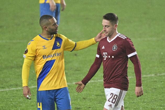Kevin Mensah of Brondby, left, and Tomas Wiesner of Sparta during the UEFA Europa League group A soccer match Sparta Praha vs Brondby Copenhagen in Prague, Czech Republic, December 9, 2021. (CTKxPhoto RomanxVondrous) CTKPhotoP2021120909638 