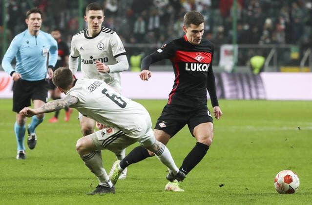 WARSAW, POLAND - DECEMBER 9, 2021: Legia s Mattias Johansson and Spartak s Jorrit Hendrix (L-R front) struggle for the ball in the 2021 22 UEFA Europa League Group C Round 6 match between Spartak Moscow and Legia Warsaw at the Marshall Jozef Pilsudski s Municipal Stadium of Legia Warsaw. Alexander Demianchuk TASS  TS11B4D0