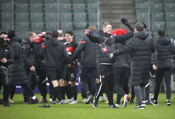 WARSAW, POLAND - DECEMBER 9, 2021: Spartakâ€™s players celebrate victory in the 2021 22 UEFA Europa League Group C Round 6 match between Spartak Moscow and Legia Warsaw at the Marshall Jozef Pilsudski s Municipal Stadium of Legia Warsaw. Alexander Demianchuk TASS  TS11B4DA