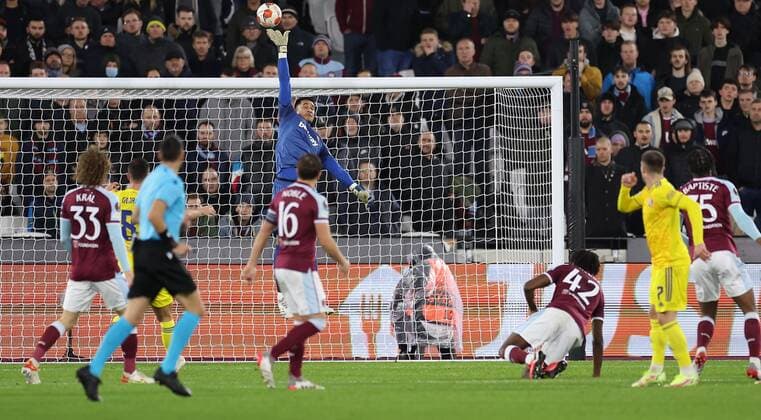 Mandatory Credit: Photo by Simon Dael Shutterstock (12637595ap) West Ham goalkeeper Alphonse Areola makes a save from Luka Ivanusec of Dinamo Zagreb West Ham United v Dinamo Zagreb, UEFA Europa League, Group H, Football, London Stadium, London, UK - 09 Dec 2021 EDITORIAL USE ONLY No use with unauthorised audio, video, data, fixture lists, club league logos or live services. Online in-match use limited to 120 images, no video emulation. No use in betting, games or single club league player publications. West Ham United v Dinamo Zagreb, UEFA Europa League, Group H, Football, London Stadium, London, UK - 09 Dec 2021 EDITORIAL USE ONLY No use with unauthorised audio, video, data, fixture lists, club league logos or live services. Online in-match use limited to 120 images, no video emulation. No use in betting, games or single club league player publications.  Copyright: xSimonxDael Shutterstockx 12637595ap